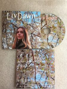 Card wallet with cd picture of a girl with long hair and autumnal tree behind her