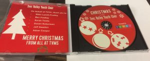 red cd with christmas baubles in plastic case