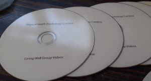 3 white cds with printing covid 19 help videos