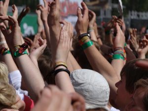 woman music festival hands and wrists with bands