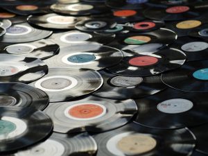 lots of 12 inch vinyl disc spread over the floor